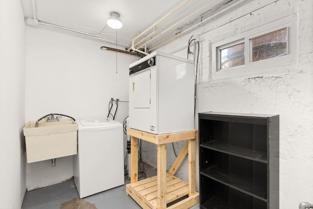 clothes washing area with stacked washer / dryer and a sink