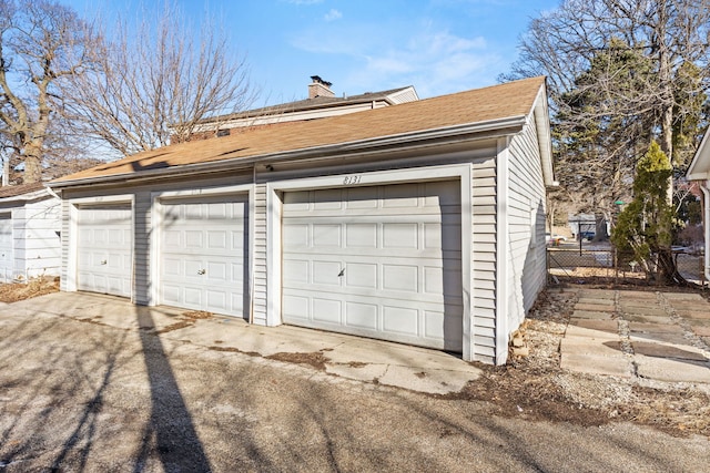 garage featuring fence