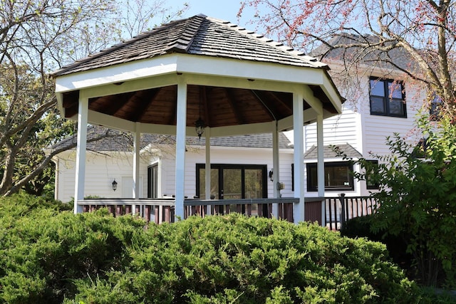 rear view of house featuring a gazebo