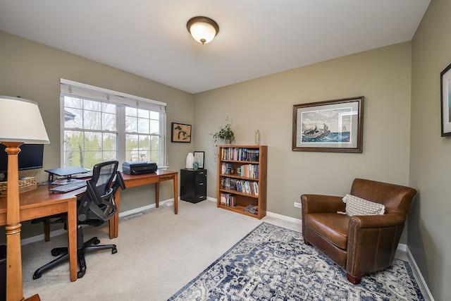 office area with light carpet, visible vents, and baseboards