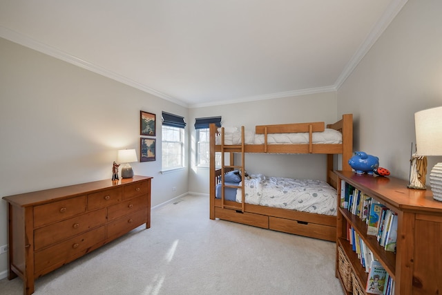 carpeted bedroom featuring baseboards and ornamental molding