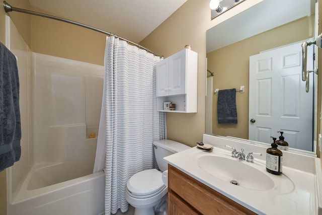 bathroom with toilet, vanity, and shower / tub combo