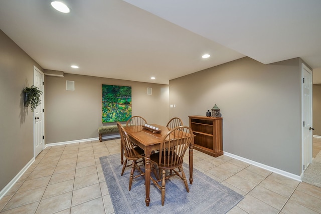 dining area featuring light tile patterned floors, recessed lighting, and baseboards