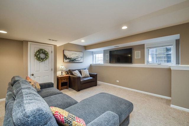 living area with recessed lighting, visible vents, baseboards, and carpet