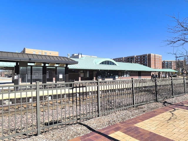 view of home's community with fence