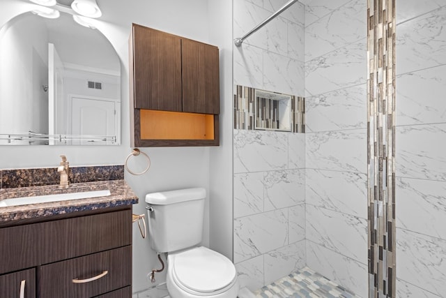 full bathroom with toilet, a shower stall, visible vents, and vanity