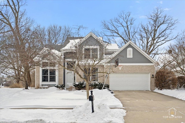 view of front facade with brick siding, concrete driveway, and a garage