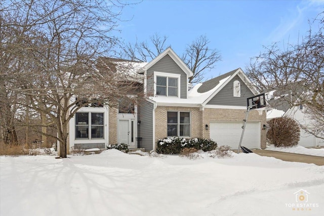 view of front of home featuring brick siding and a garage