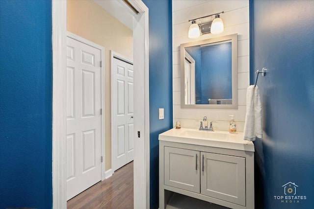 bathroom featuring vanity and wood finished floors