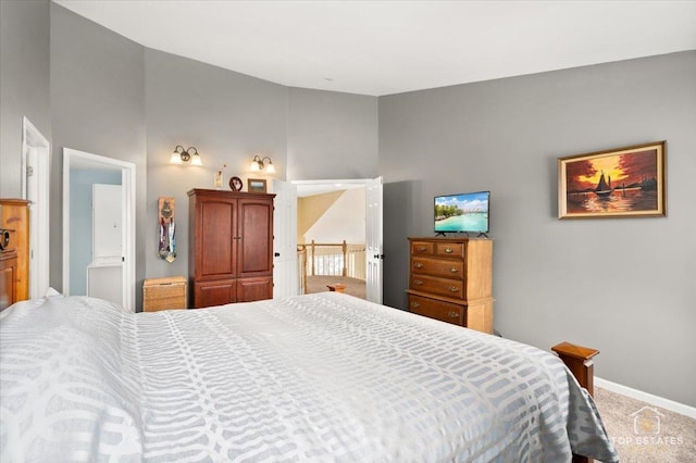 carpeted bedroom with baseboards