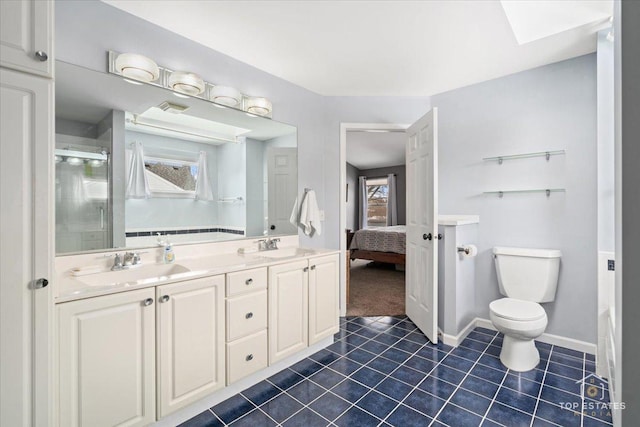 full bath with tile patterned flooring, baseboards, toilet, a stall shower, and a sink