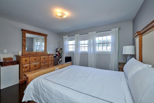 bedroom featuring dark wood-type flooring