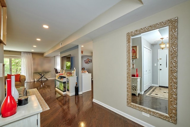 corridor with visible vents, baseboards, wood finished floors, and recessed lighting