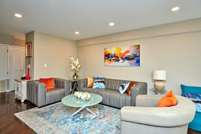 living area with visible vents, wood finished floors, and recessed lighting