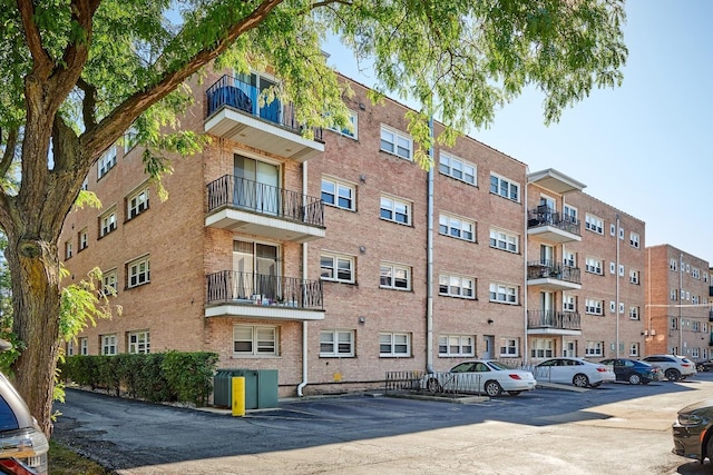 view of property featuring uncovered parking