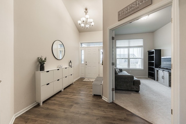 1125 Juniper Dr, Sycamore, IL 60178 - foyer entrance featuring baseboards, plenty of natural light, a chandelier, dark wood-type flooring, and high vaulted ceiling