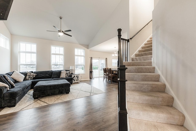 1125 Juniper Dr, Sycamore, IL 60178 - living room featuring a ceiling fan, plenty of natural light, stairs, wood finished floors, and high vaulted ceiling