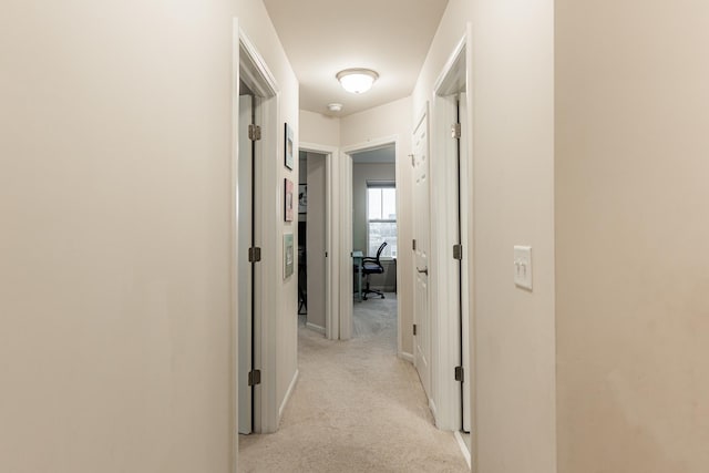 1125 Juniper Dr, Sycamore, IL 60178 - hall with light colored carpet, an office area, and baseboards