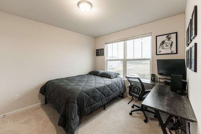 1125 Juniper Dr, Sycamore, IL 60178 - bedroom with an office area, baseboards, and light colored carpet
