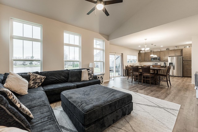 1125 Juniper Dr, Sycamore, IL 60178 - living area with a ceiling fan, light wood-type flooring, recessed lighting, a chandelier, and lofted ceiling