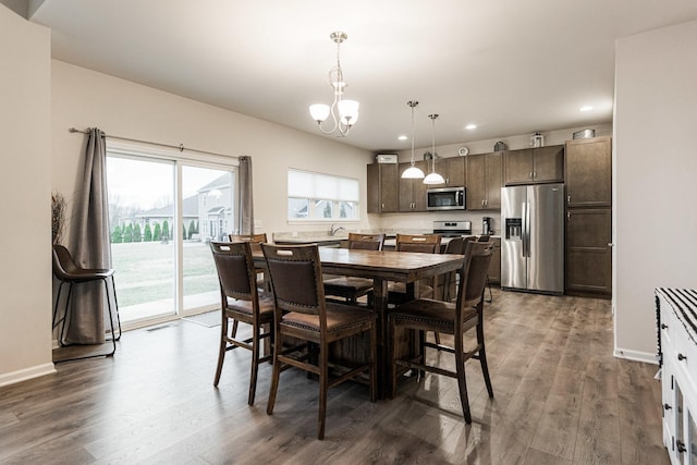 1125 Juniper Dr, Sycamore, IL 60178 - dining area with recessed lighting, wood finished floors, a chandelier, and baseboards