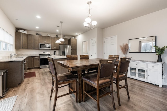 1125 Juniper Dr, Sycamore, IL 60178 - dining area with light wood-style floors, a chandelier, and recessed lighting