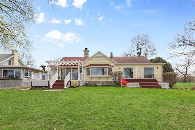 2115 N Woodlawn Park Ave, Mchenry, IL 60051 - rear view of property featuring a yard, a pergola, fence, and a chimney