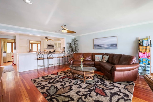 2115 N Woodlawn Park Ave, Mchenry, IL 60051 - living room featuring a ceiling fan, hardwood / wood-style floors, and crown molding