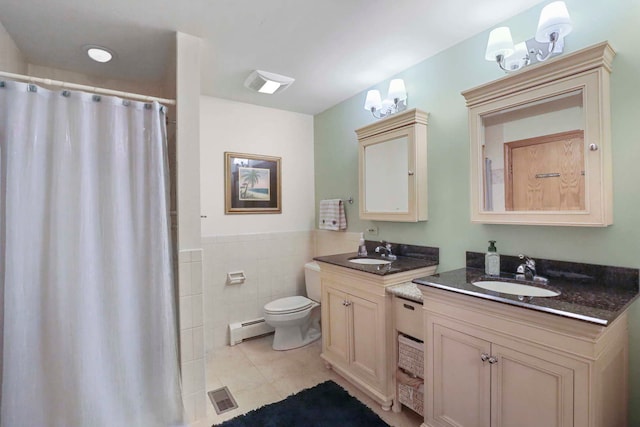 2115 N Woodlawn Park Ave, Mchenry, IL 60051 - full bath featuring a sink, visible vents, toilet, and a baseboard heating unit
