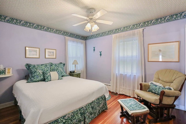 2115 N Woodlawn Park Ave, Mchenry, IL 60051 - bedroom featuring a textured ceiling, wood finished floors, ceiling fan, and baseboards