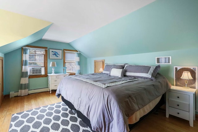 2115 N Woodlawn Park Ave, Mchenry, IL 60051 - bedroom featuring cooling unit, visible vents, baseboard heating, lofted ceiling, and wood-type flooring