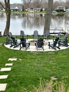 2115 N Woodlawn Park Ave, Mchenry, IL 60051 - view of community featuring a water view, a patio, and a lawn