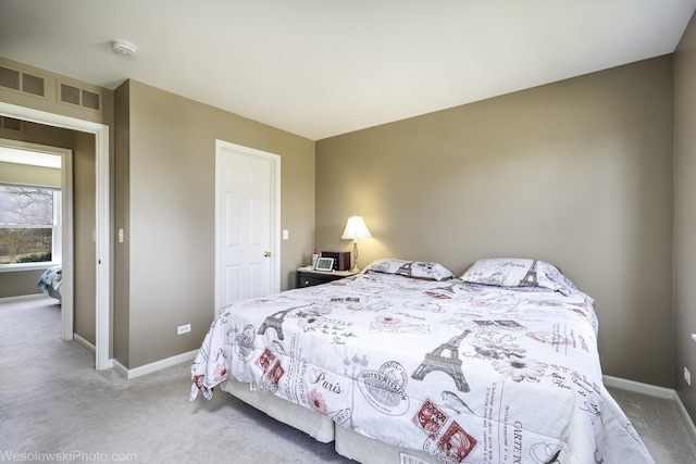 carpeted bedroom with baseboards