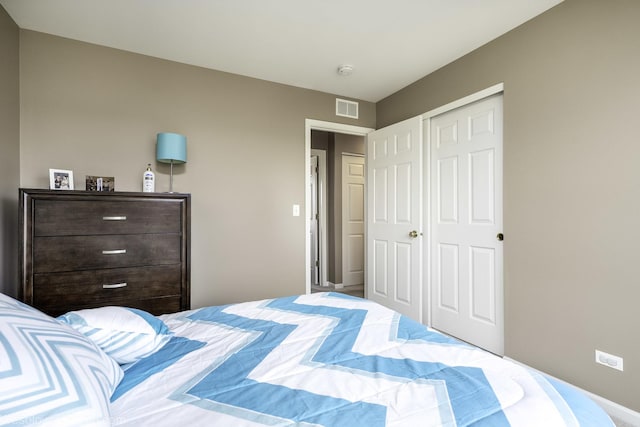 bedroom featuring a closet and visible vents