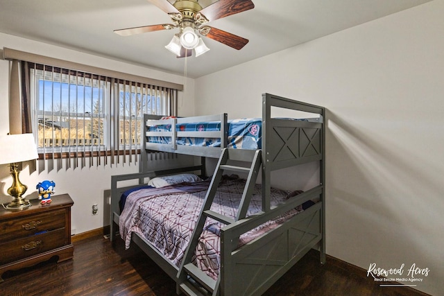 bedroom with wood finished floors, a ceiling fan, and baseboards