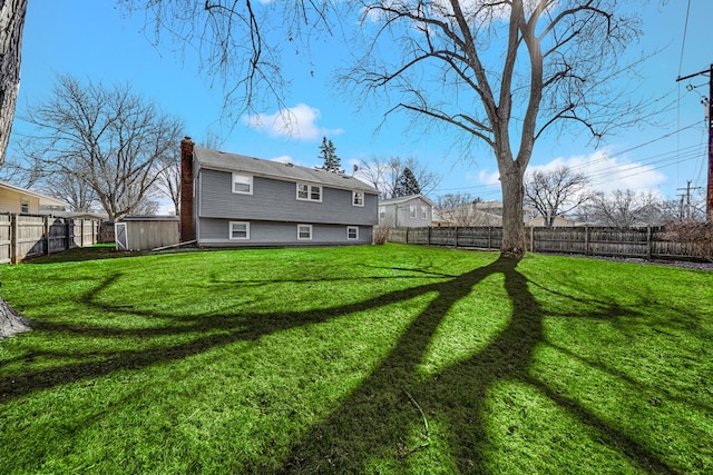 view of yard with a fenced backyard