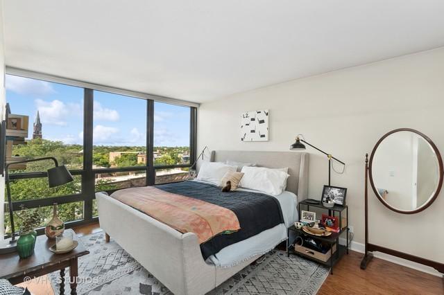 bedroom with baseboards, wood finished floors, and floor to ceiling windows