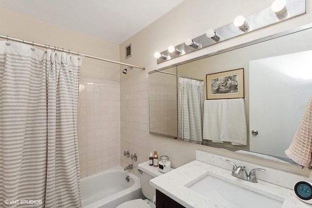 full bath with visible vents, shower / bath combination with curtain, toilet, and vanity