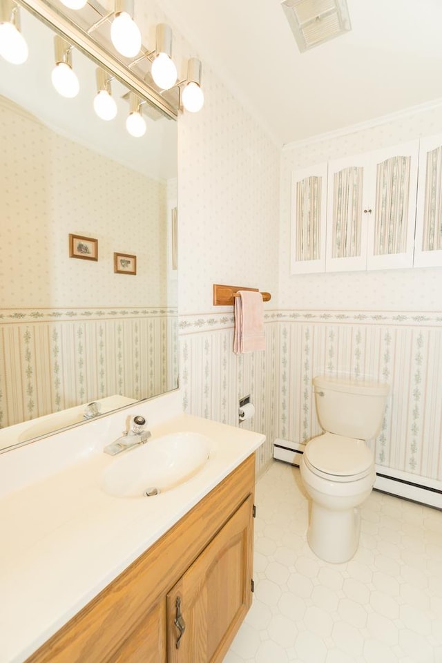 bathroom featuring a baseboard radiator, toilet, and wallpapered walls