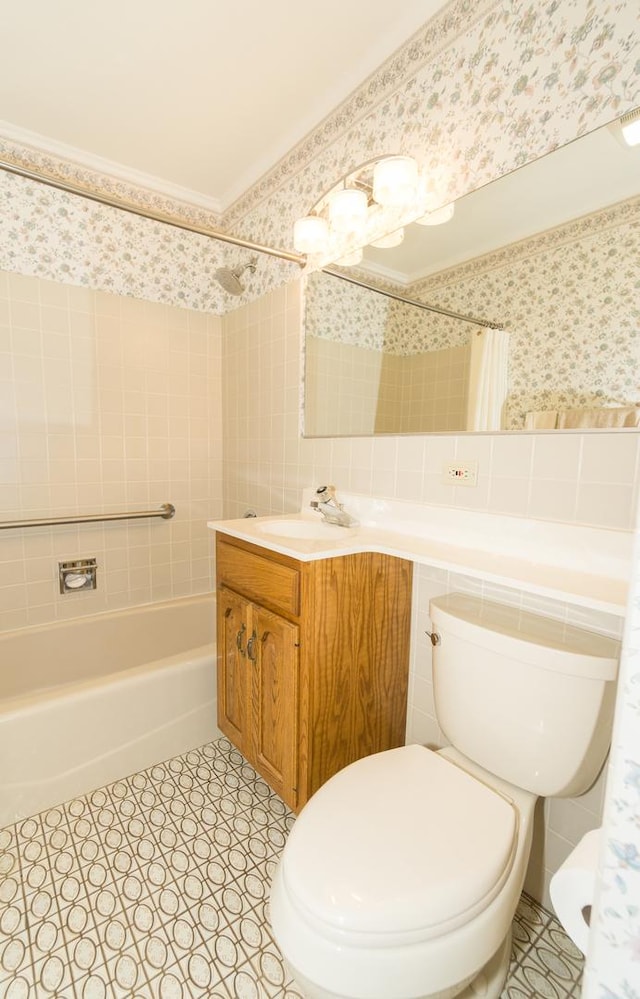 bathroom with wallpapered walls, toilet, a wainscoted wall, shower / tub combo with curtain, and tile walls