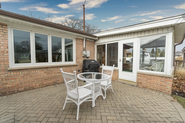 view of patio featuring outdoor dining area and grilling area