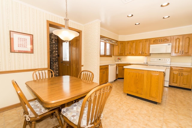 kitchen featuring recessed lighting, light countertops, a kitchen island, white appliances, and wallpapered walls