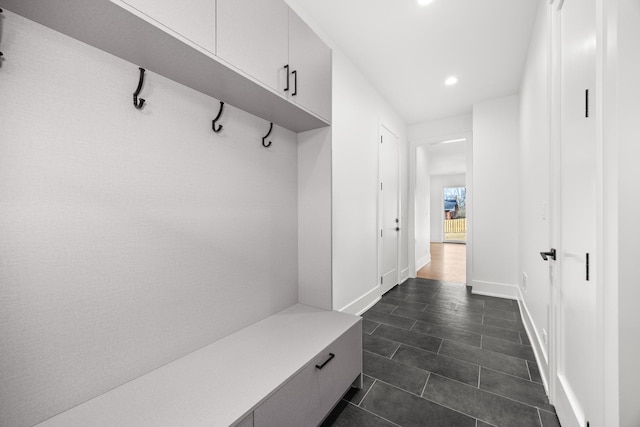 mudroom with baseboards and recessed lighting