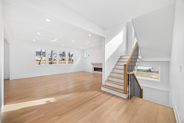 living area with plenty of natural light, recessed lighting, a fireplace, and light wood-style floors