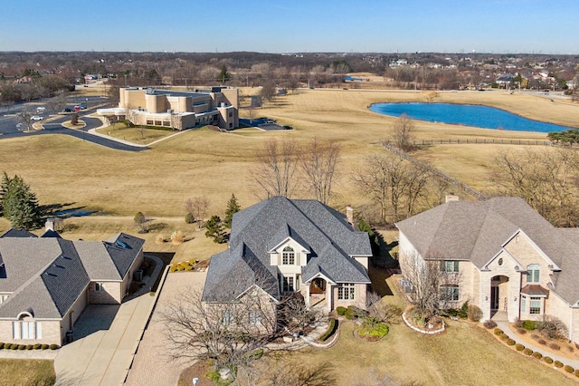 aerial view featuring a water view and a residential view