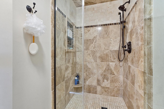 bathroom featuring tiled shower