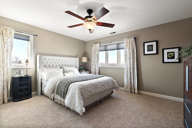 bedroom with visible vents, ceiling fan, baseboards, and carpet floors