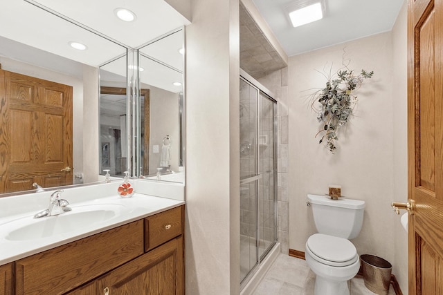 full bath with tile patterned flooring, a stall shower, toilet, and vanity