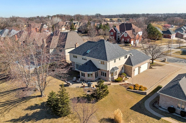 birds eye view of property with a residential view