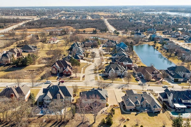 birds eye view of property featuring a residential view and a water view